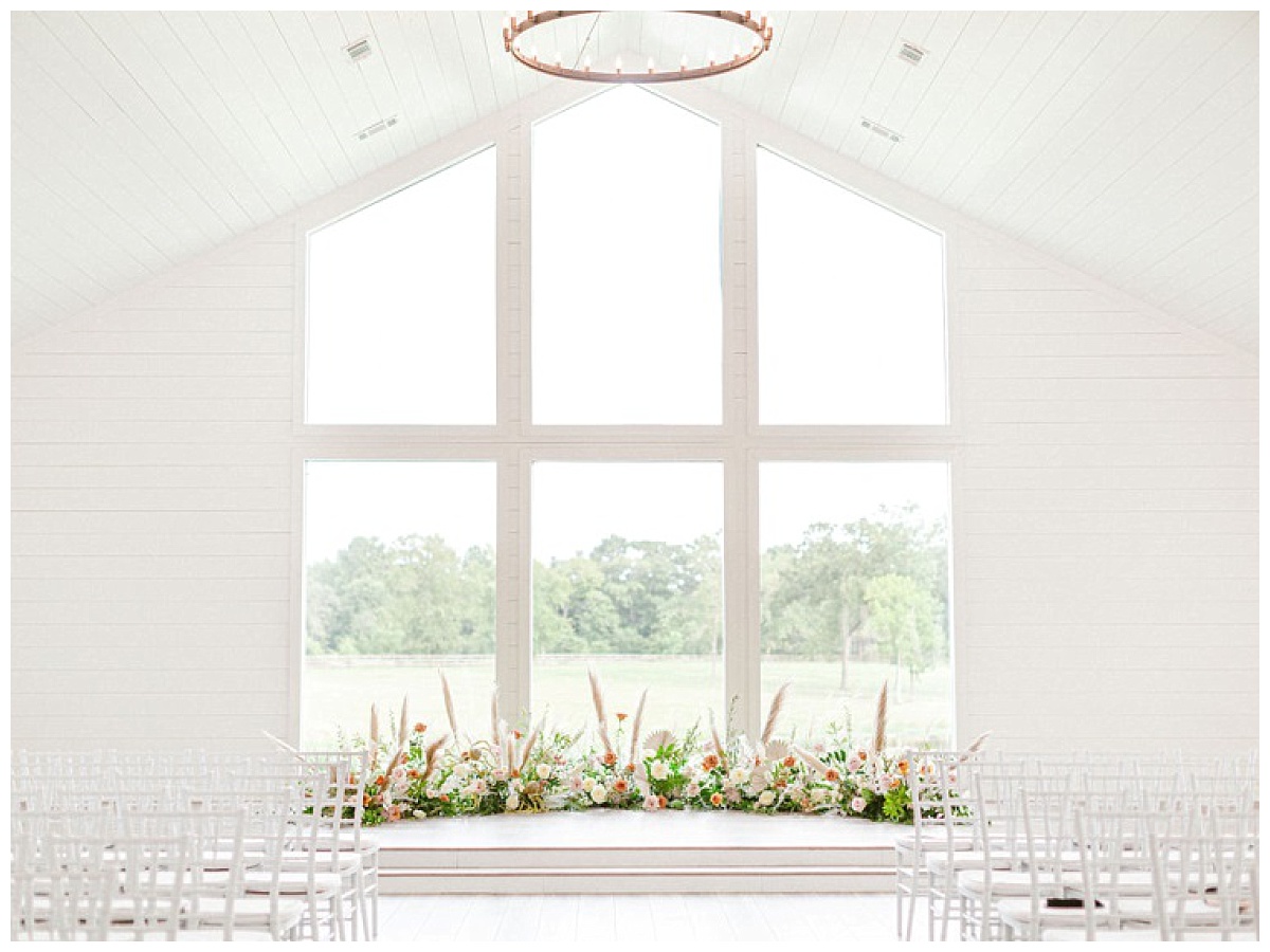 The Chapel windows with floral decorations | The Farmhouse Events Real Weddings | A Summer Vision of Love | Kristin & Rob