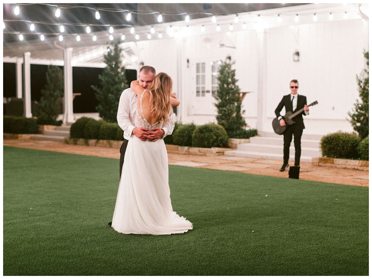 private last dance in courtyard with guitarrist and cafe lighting | The Farmhouse Events Real Weddings | A Summer Vision of Love | Kristin & Rob